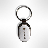 Linamar keychain with company logo, a silver metal keychain featuring the Linamar logo in black. The perfect accessory for any Linamar employee. Great for keeping keys organized and easy to find.